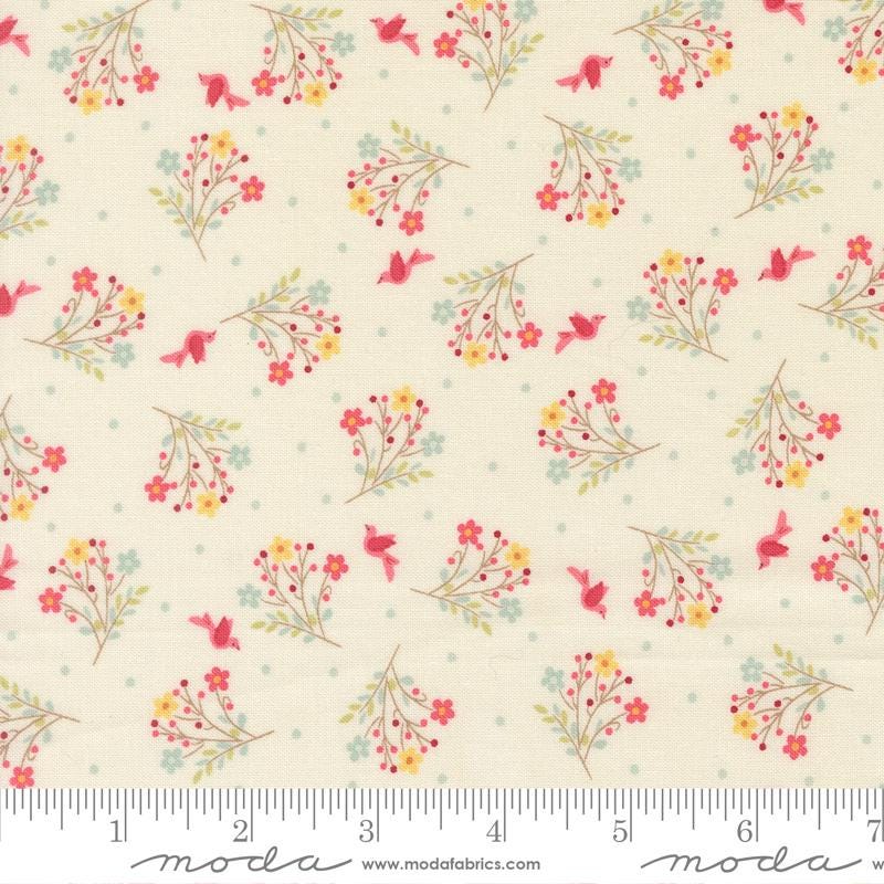 The image is a fabric with a repeating pattern of small flowers and birds on a light background.