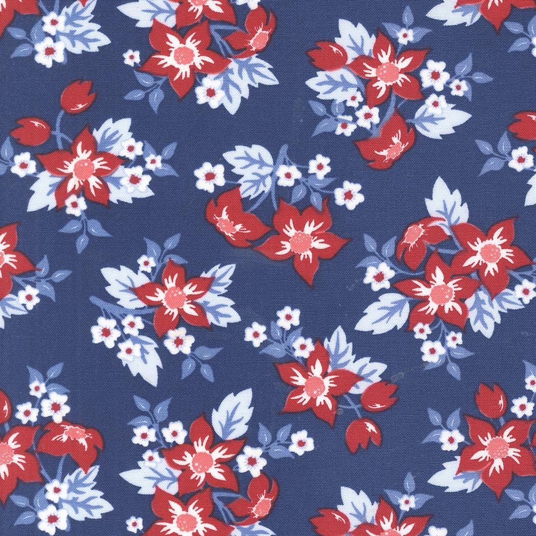a repeating pattern of red and white flowers against a dark blue background.