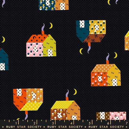 The image is a collage of various colorful houses and crescent moons against a dark background.