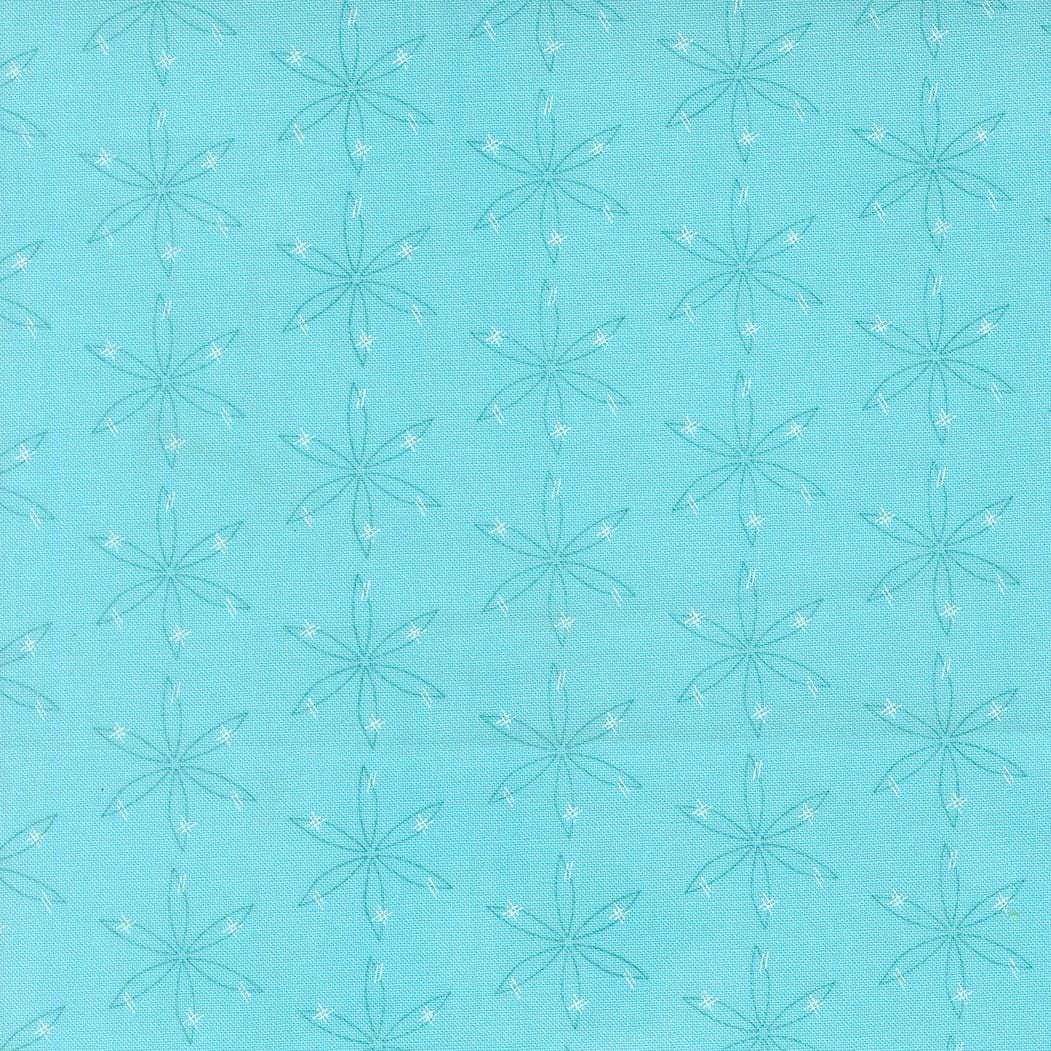 a repeating pattern of white star-like designs on a light blue background.