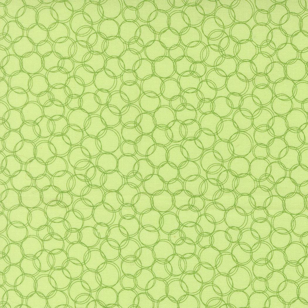 a repeating pattern of green circles on a light green background.