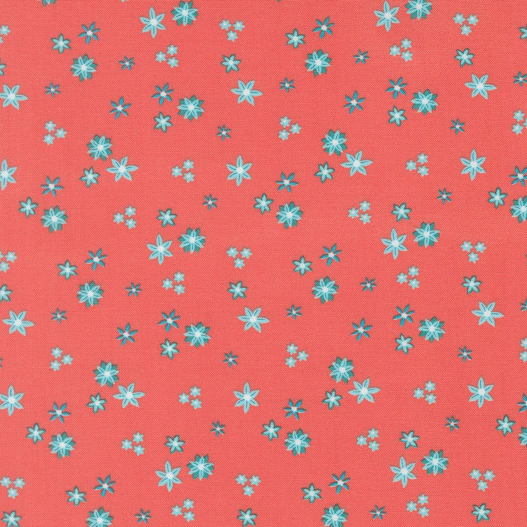 a pattern of small blue and white flowers scattered across a bright red background.
