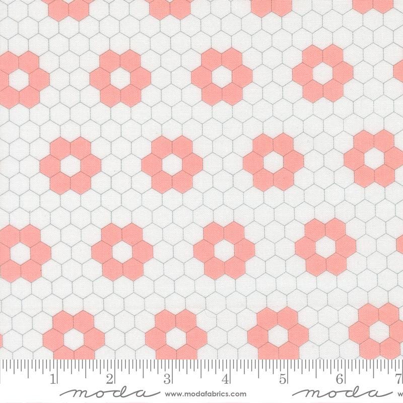 a repeating pattern of pink hexagons on a white background.