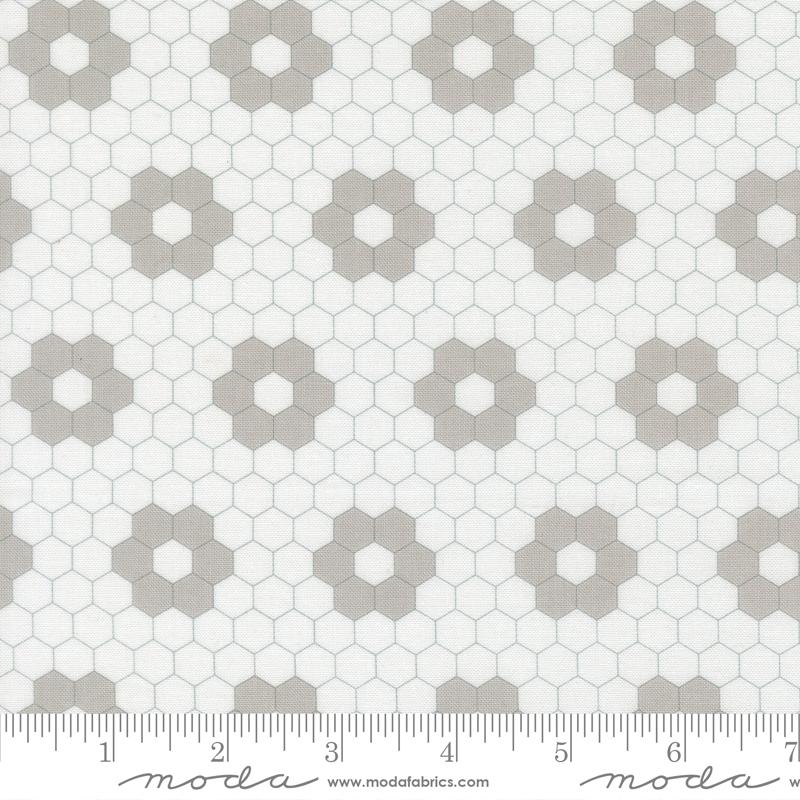 a repeating pattern of hexagonal shapes in various shades of gray and white, creating a visually striking and geometric design.