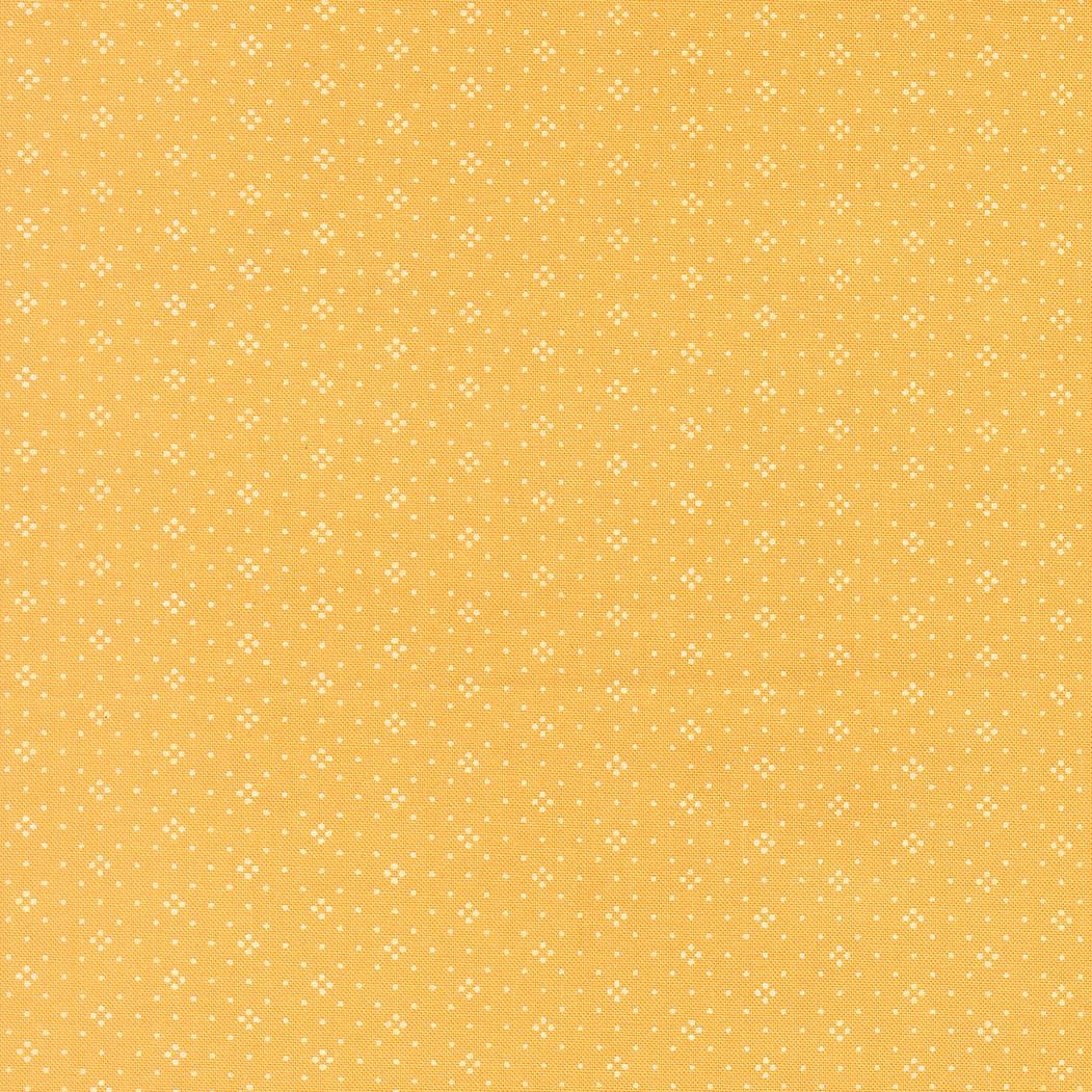 a repeating pattern of small white dots on a yellow background.