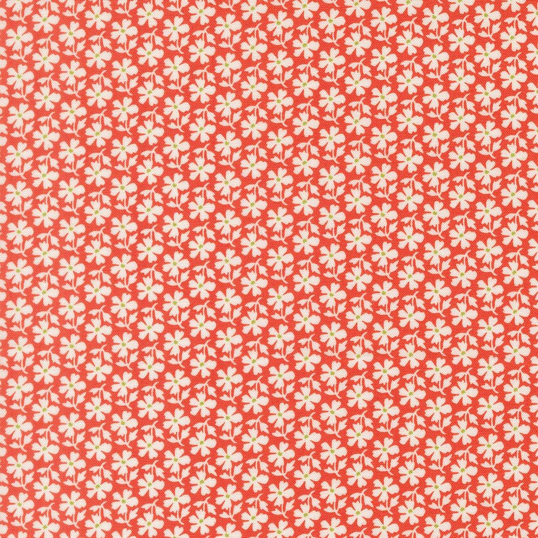 a repeating pattern of red flowers with white centers, creating a visually striking and symmetrical design.