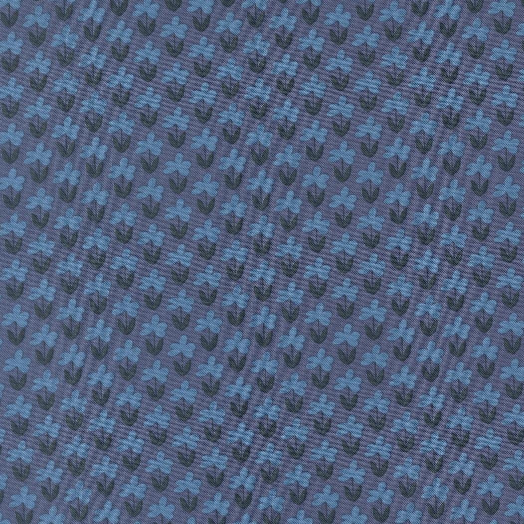 a repeating pattern of blue flowers on a dark background.
