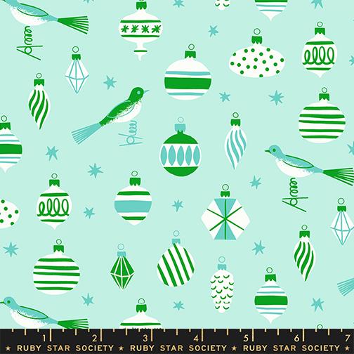 a pattern of various Christmas ornaments and birds against a light blue background.