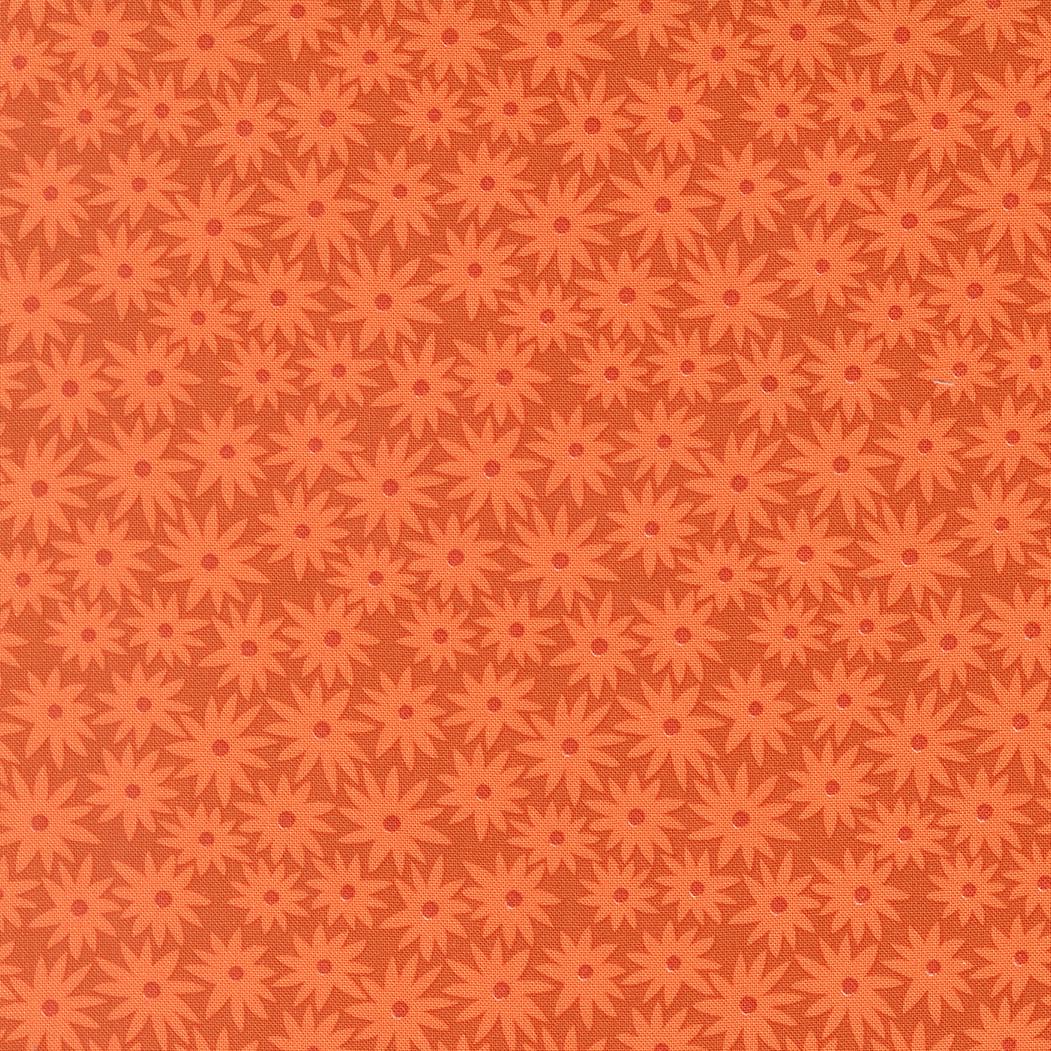 a repeating pattern of orange flowers on a dark background.