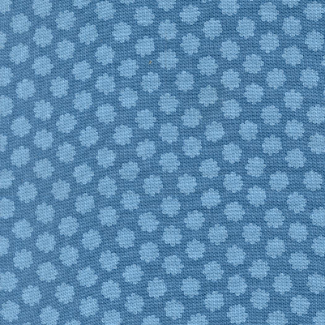a repeating pattern of blue flowers on a blue background.