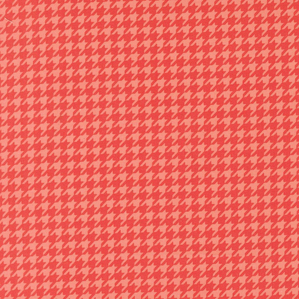 a repeating pattern of red and pink hues, creating a visually striking and symmetrical design.