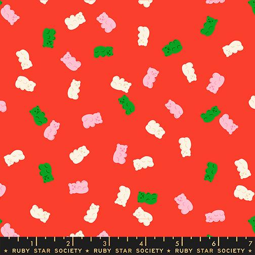 a vibrant red background with a playful pattern of pink and green gummy bears scattered across it.