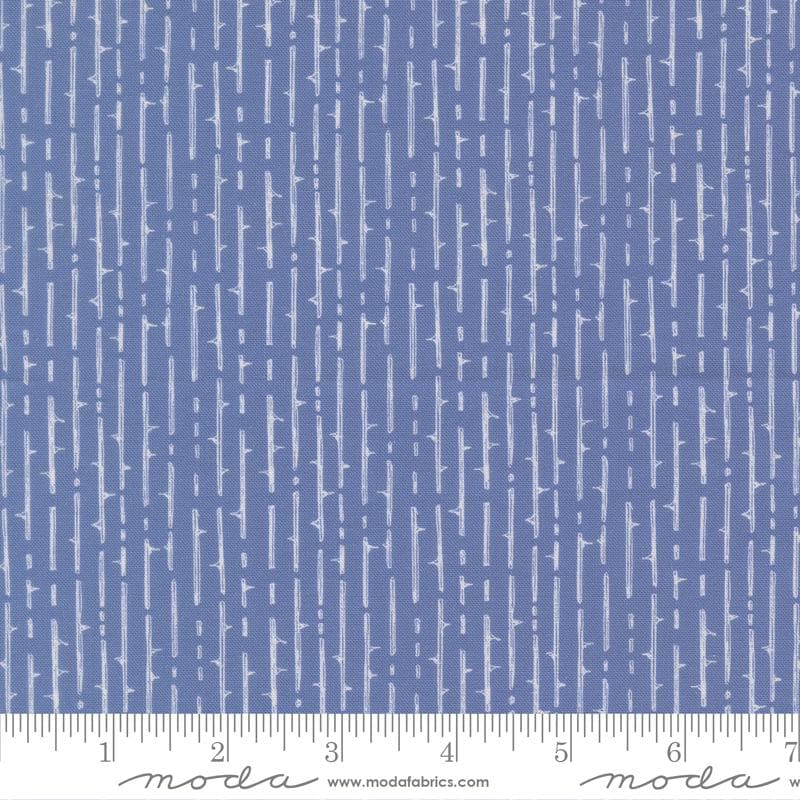 The image is a close-up of a fabric with a repeating pattern of vertical lines in various shades of blue.