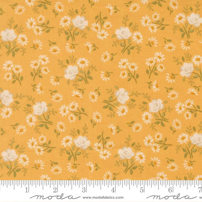 The image is a fabric with a repeating pattern of white flowers and leaves on a yellow background.