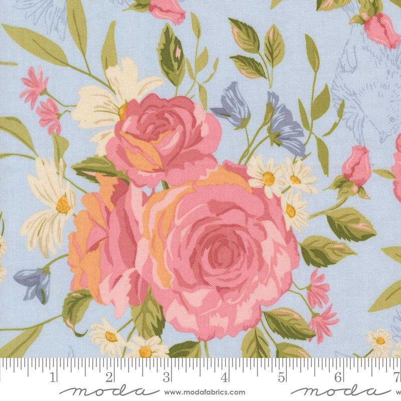 a close-up view of a vibrant floral print with pink roses, white daisies, and green leaves against a light blue background.