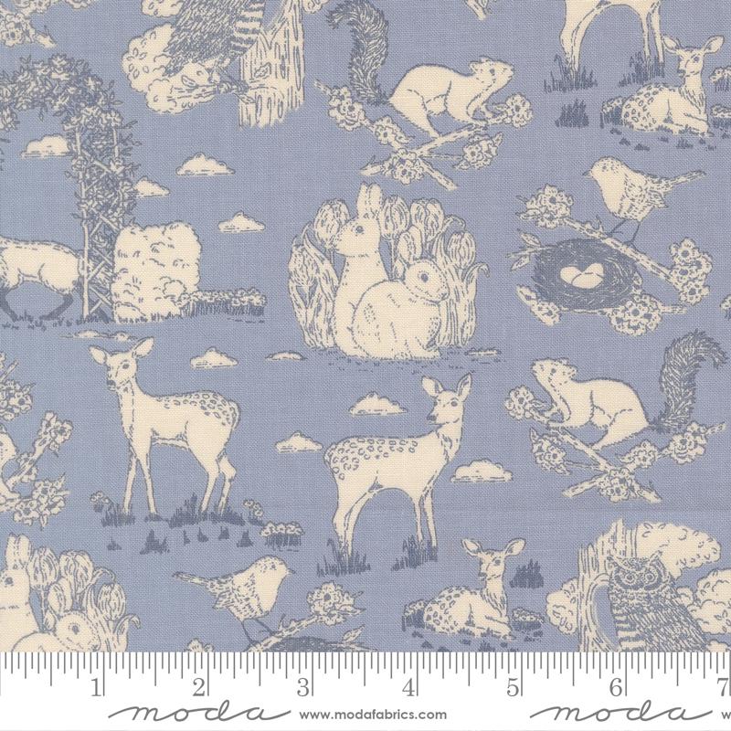 The image is a fabric print featuring various animals, including deer, birds, and squirrels, set against a blue background. The print is designed with a repeating pattern of these animals, creating a visually appealing and nature-inspired design.
