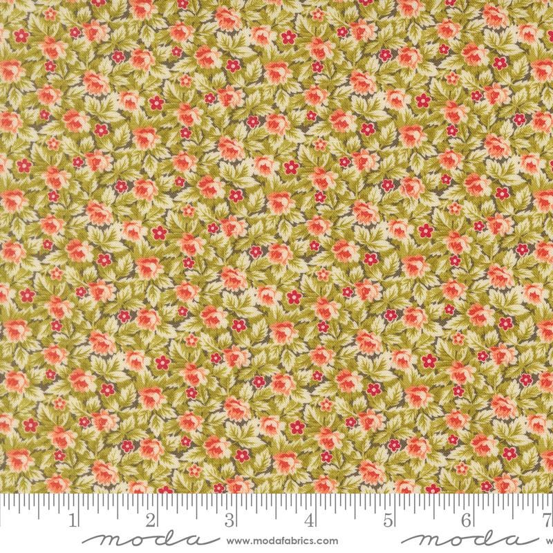 The image is a close-up of a fabric with a floral pattern, featuring small red flowers and green leaves. The fabric appears to be a type of cotton or linen material, with a repeating pattern of flowers and leaves. The image does not contain any text or other discernible objects or actions.
