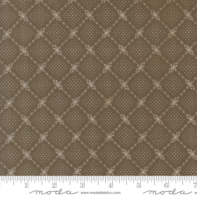 The image is a close-up of a brown fabric with a diamond pattern, featuring small white dots arranged in a repeating diamond shape.