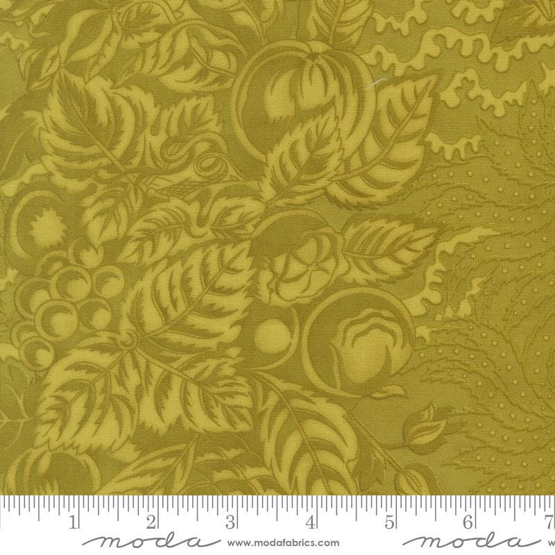 The image is a close-up of a fabric with a repeating pattern of leaves and flowers in a gold color.