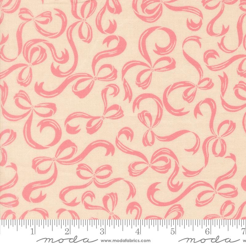 a repeating pattern of pink bows on a beige background.