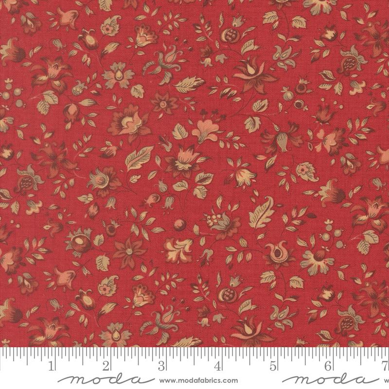 The image is a close-up of a red fabric with a floral pattern, featuring various shades of red, brown, and green flowers and leaves.