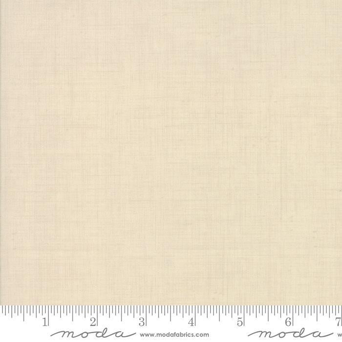 The image is a plain, light-colored fabric with a ruler for scale.