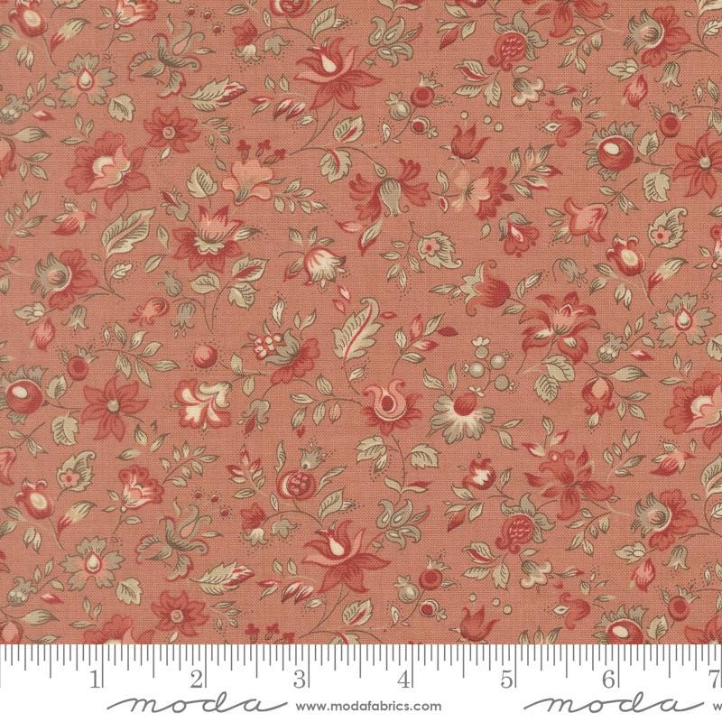 The image is a close-up of a fabric with a floral pattern in shades of red and beige. The fabric appears to be a textile or material with a repeating floral design.