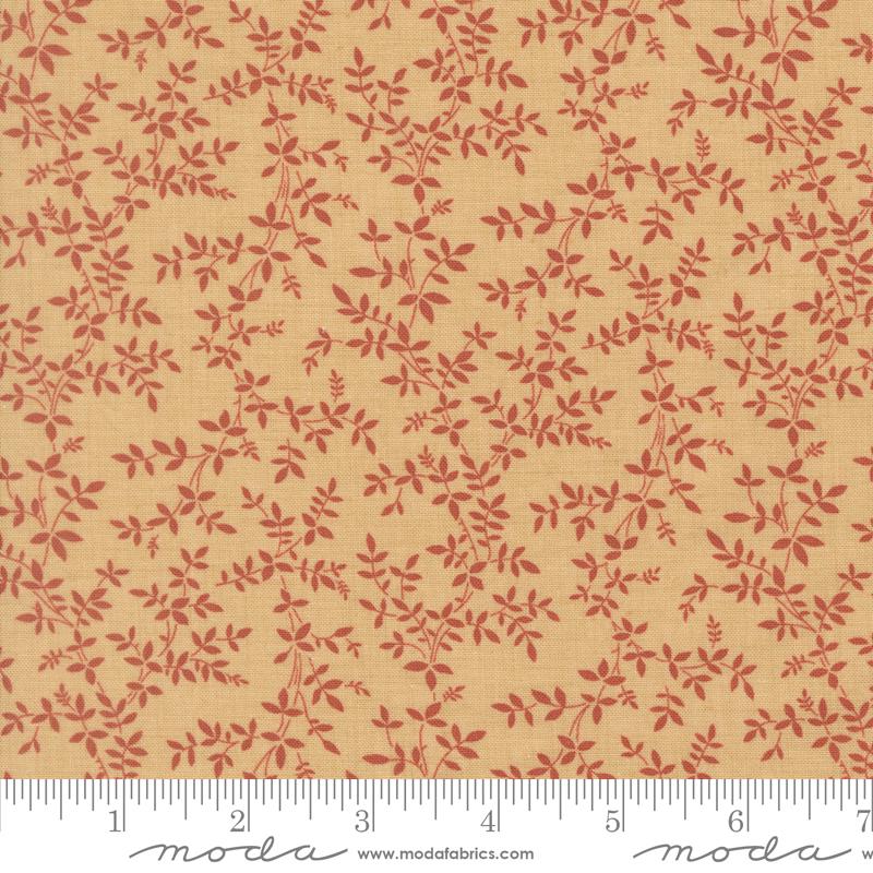 a fabric with a repeating pattern of red leaves and branches on a beige background.