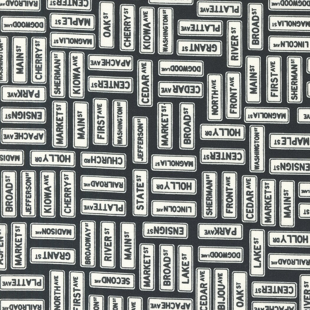 Main Street Street Signs Black Yardage 55643-25 by Sweetwater for Moda Fabrics Sold In 1/2 yard increments cut continuously