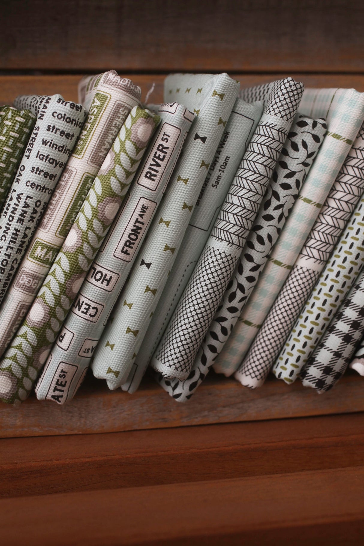 Main Street Street Signs Black Yardage 55643-25 by Sweetwater for Moda Fabrics Sold In 1/2 yard increments cut continuously
