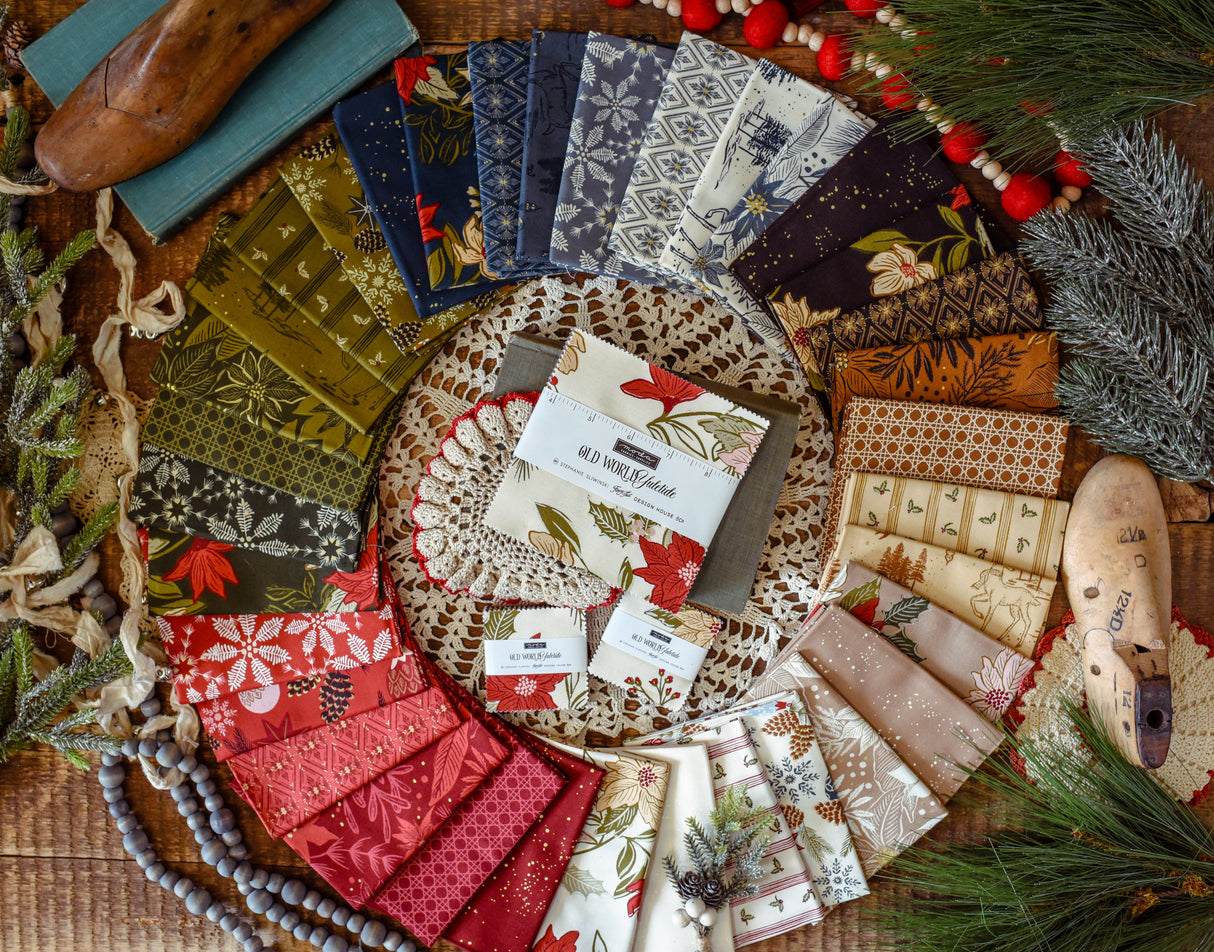 Yuletide Treats Quilt Kit features Old World Yuletide by Fancy That Design House Fabrics for the quilt top, backing and Pattern 52 x 61
