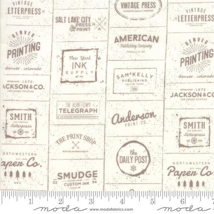 The Print Shop Cream and Clay Logos Yardage 5740-22 Sold in 1/2 yard increments cut continuously