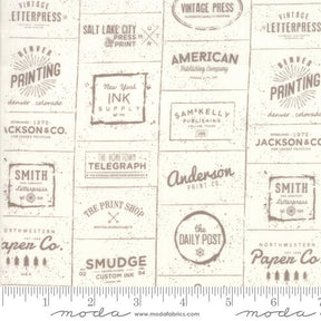 The Print Shop Cream and Clay Logos Yardage 5740-22 Sold in 1/2 yard increments cut continuously