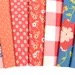 Sunwashed Windflower Toss Carnation Yardage 29162-22 by Moda Fabrics Sold in 1/2 yard increments cut continuously