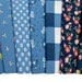 Sunwashed Windflower Toss Carnation Yardage 29162-22 by Moda Fabrics Sold in 1/2 yard increments cut continuously