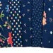 Sunwashed Windflower Toss Carnation Yardage 29162-22 by Moda Fabrics Sold in 1/2 yard increments cut continuously