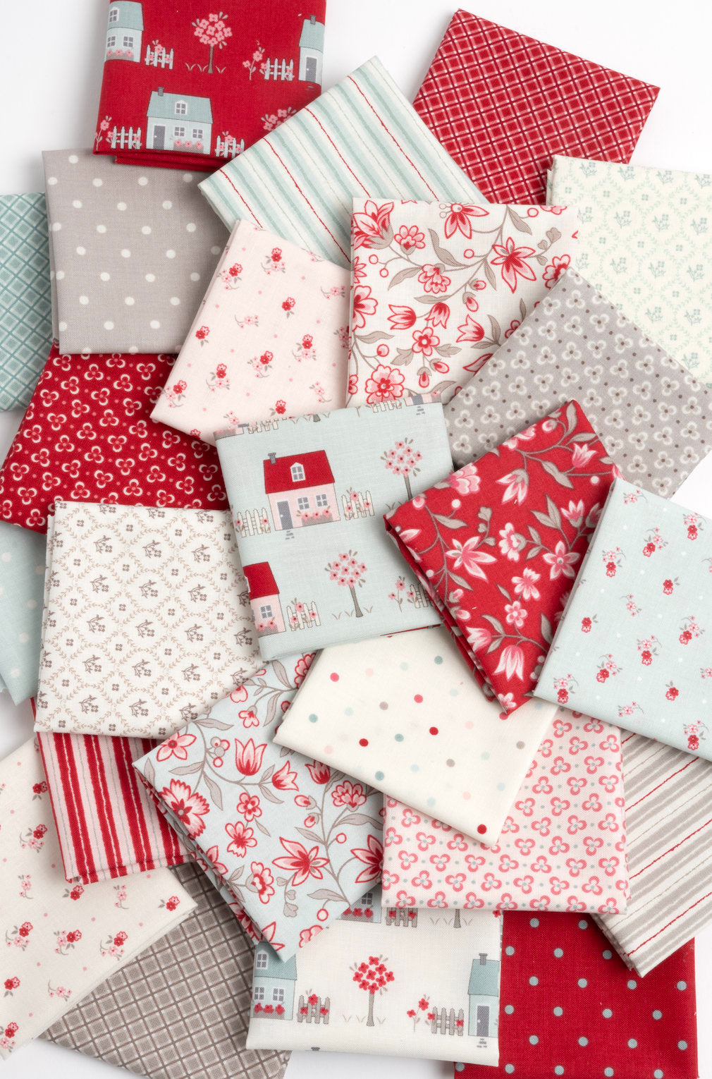 a pile of red and white fabric on top of each other
