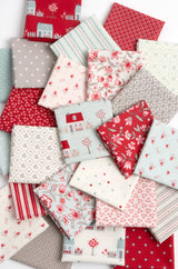 a pile of red and white fabric on top of each other