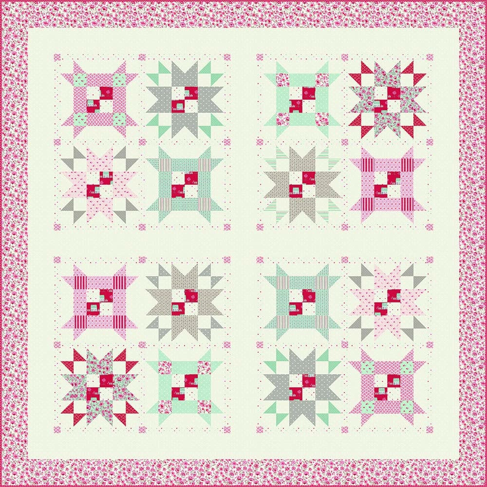 a pink and green quilt with a pink border