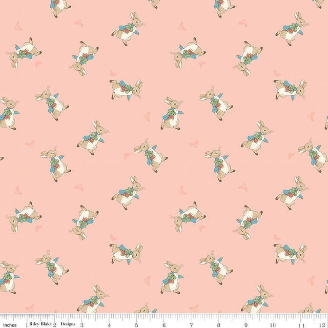 The Tale of Peter Rabbit Coral Peter Toss C14702-Coral Fabrics Sold in 1/2 Yard Increments