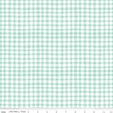 a green and white checkered fabric with a ruler