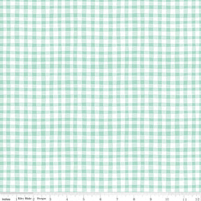 a green and white checkered fabric with a ruler