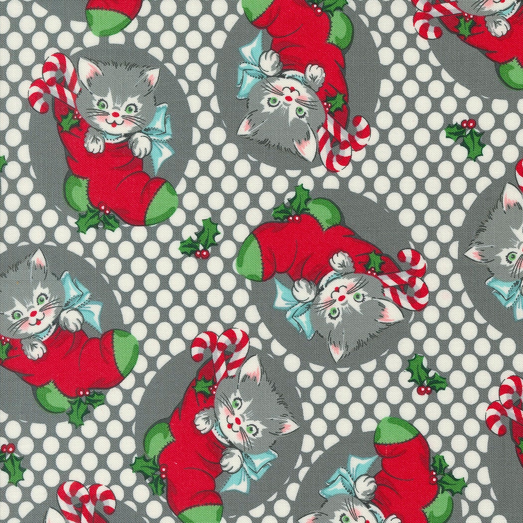 a cat with a santa hat and a candy cane on a polka dot background