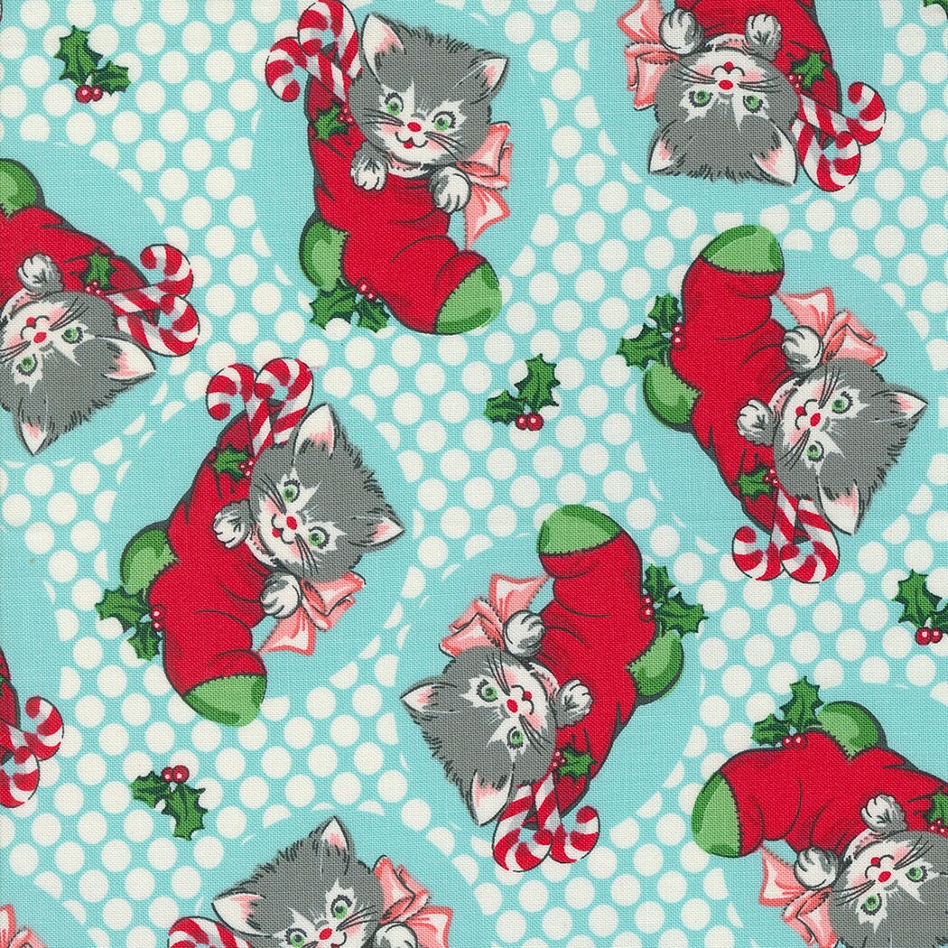 a blue and white background with a cat wearing a santa hat