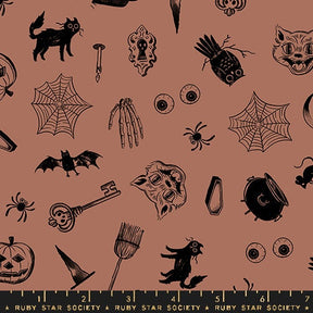 a pattern of halloween themed items on a pink background