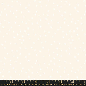 a ruler with a white sheet of paper on top of it