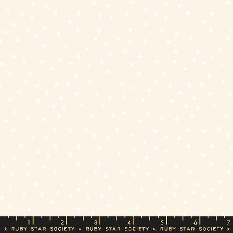 a ruler with a white sheet of paper on top of it