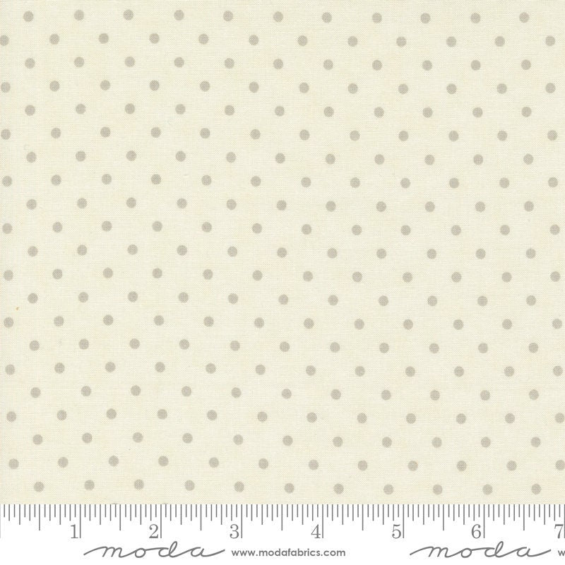 a ruler with a white polka dot pattern on it