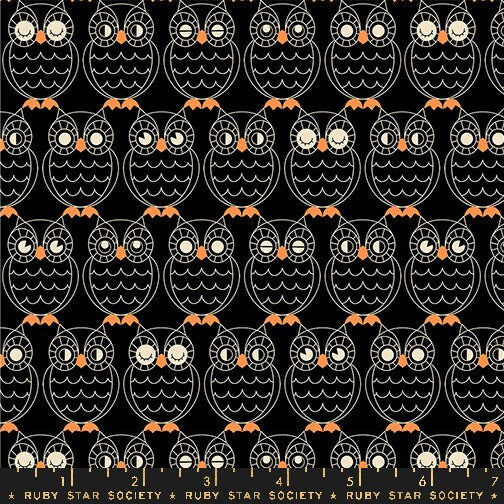a black and orange owl pattern on a black background