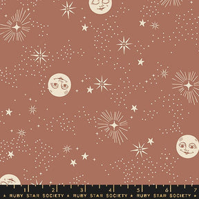 a brown background with stars and moon faces